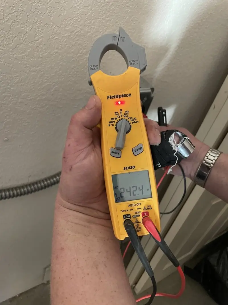 Voltage testing with clamp meter during Whole House Surge Protector in Ogden